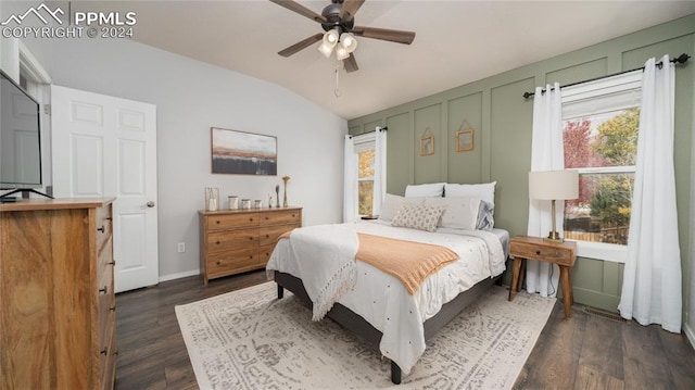 bedroom featuring ceiling fan, vaulted ceiling, and dark hardwood / wood-style floors