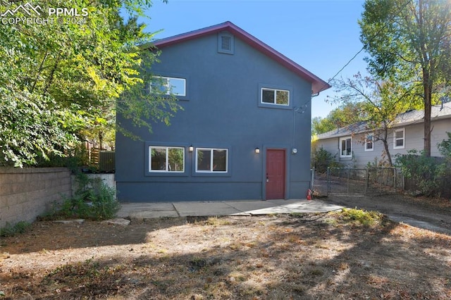 back of property featuring a patio