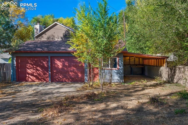 garage featuring a carport