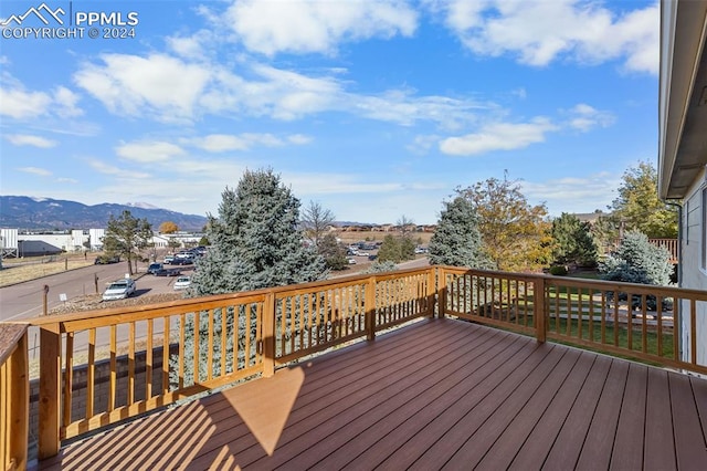 wooden deck featuring a mountain view