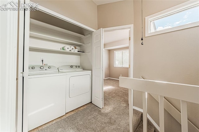 laundry room with light carpet and washing machine and dryer