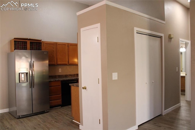 kitchen with dishwasher, stainless steel refrigerator with ice dispenser, and dark hardwood / wood-style floors