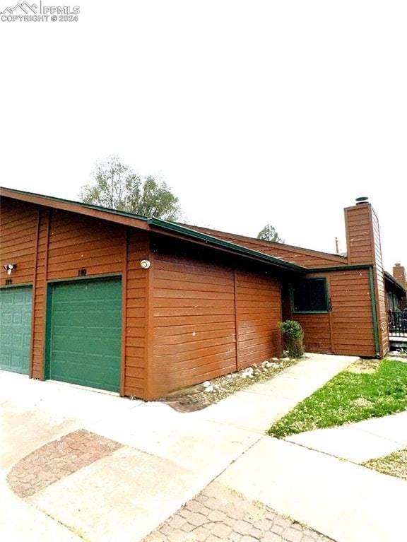 view of side of property featuring a garage