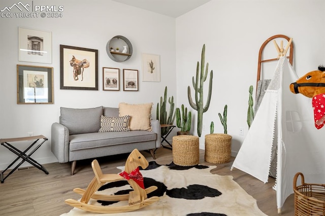 living area featuring hardwood / wood-style floors