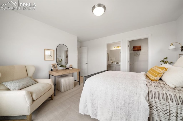 carpeted bedroom with a closet, a spacious closet, and connected bathroom