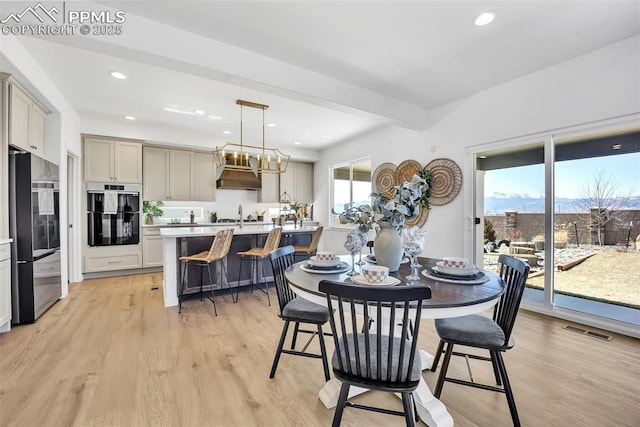 8542 Noreen Falls Dr, Colorado Springs, CO 80924 - dining area with recessed lighting, light wood-style floors, and a chandelier