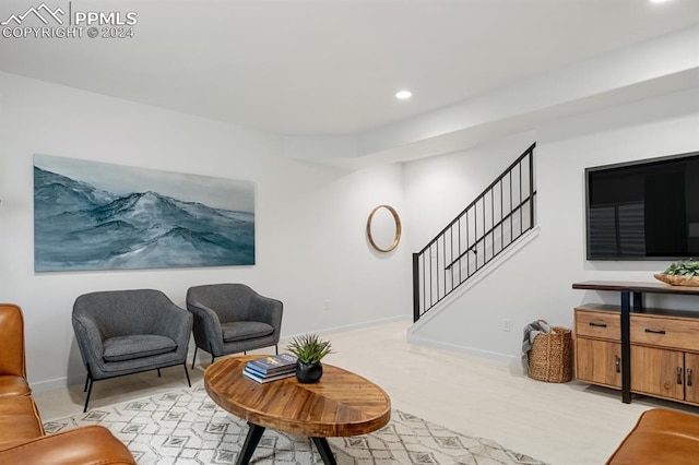 sitting room with light colored carpet