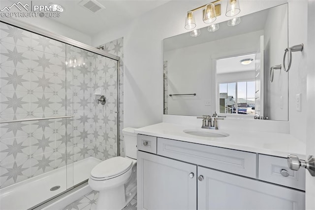 8542 Noreen Falls Dr, Colorado Springs, CO 80924 - bathroom featuring toilet, a shower stall, and vanity