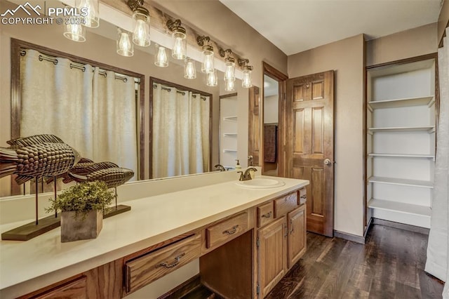 bathroom featuring vanity and hardwood / wood-style floors