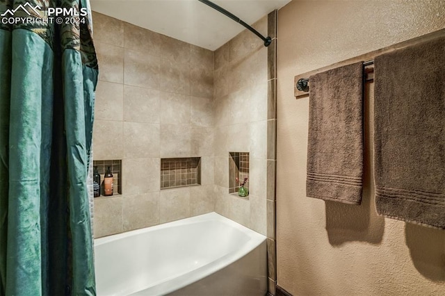 bathroom with shower / bathtub combination with curtain