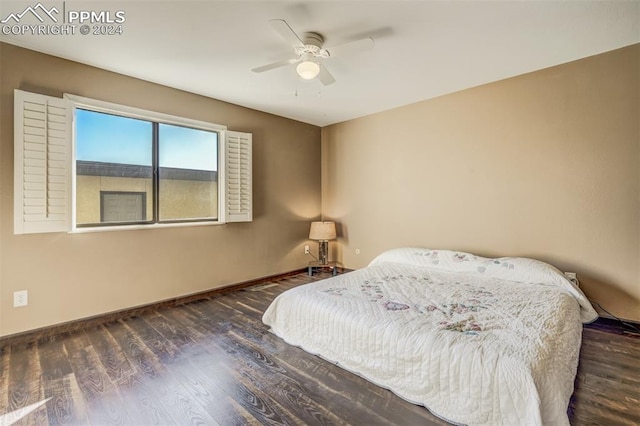 bedroom featuring dark hardwood / wood-style floors and ceiling fan