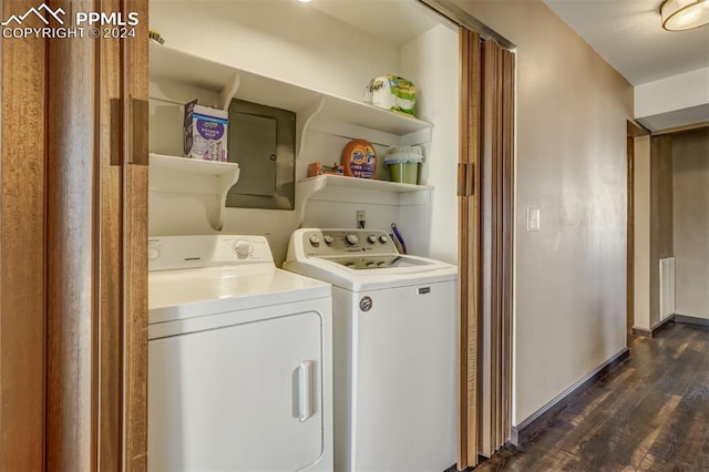 laundry area with dark wood-type flooring and washer and dryer