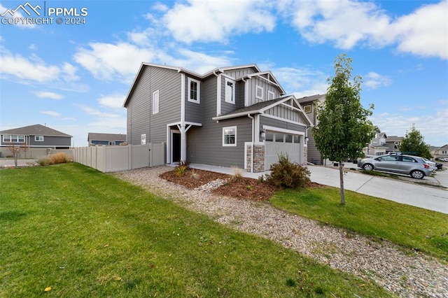 view of front of home featuring a garage and a front lawn