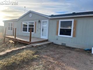 view of front of home featuring a wooden deck