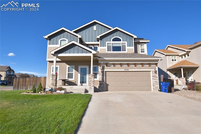 craftsman-style home with a front yard and a garage