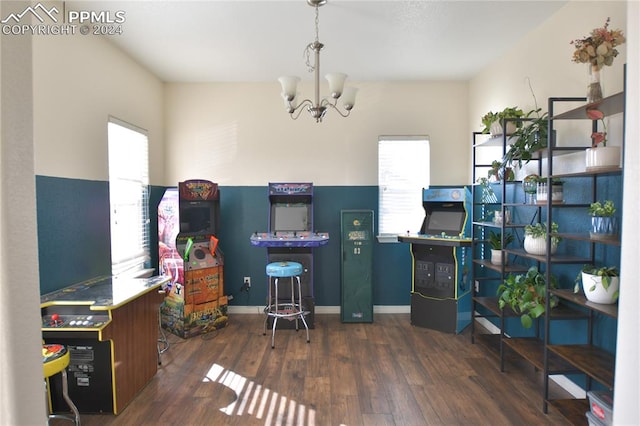 office area with dark wood-type flooring and a chandelier