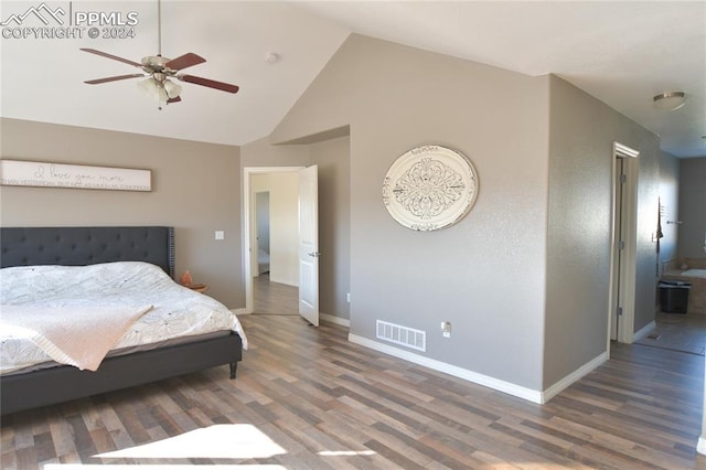 bedroom with connected bathroom, ceiling fan, lofted ceiling, and hardwood / wood-style floors