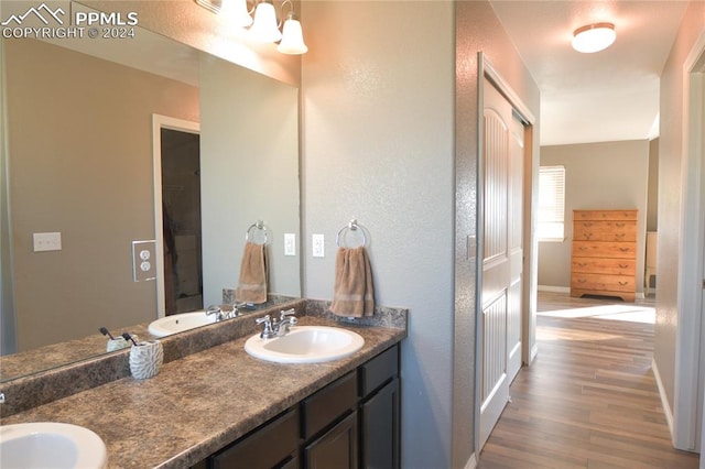 bathroom featuring vanity and hardwood / wood-style flooring