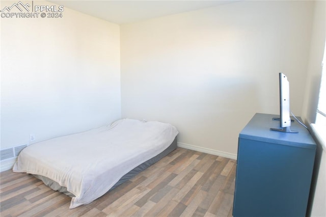 bedroom featuring hardwood / wood-style floors