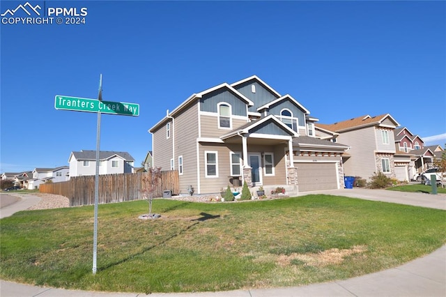 view of front facade featuring a front lawn and a garage