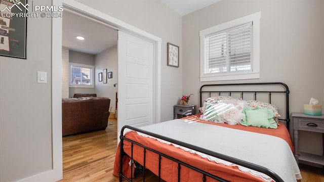 bedroom with light wood-type flooring