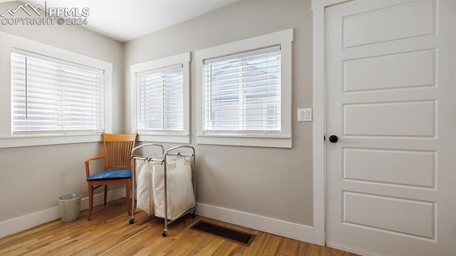 sitting room featuring light hardwood / wood-style flooring