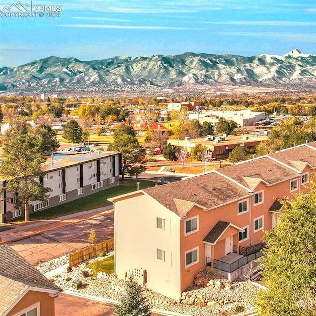 birds eye view of property with a mountain view