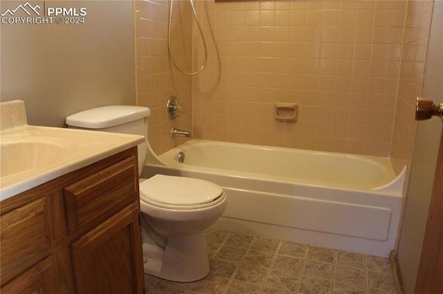 full bathroom featuring vanity, toilet, and tiled shower / bath