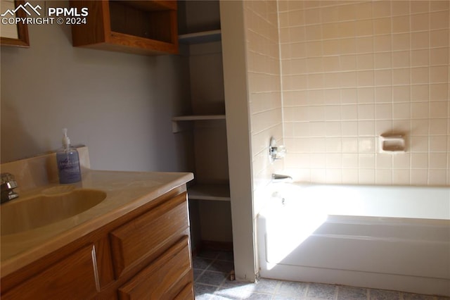 bathroom featuring vanity and a bathtub