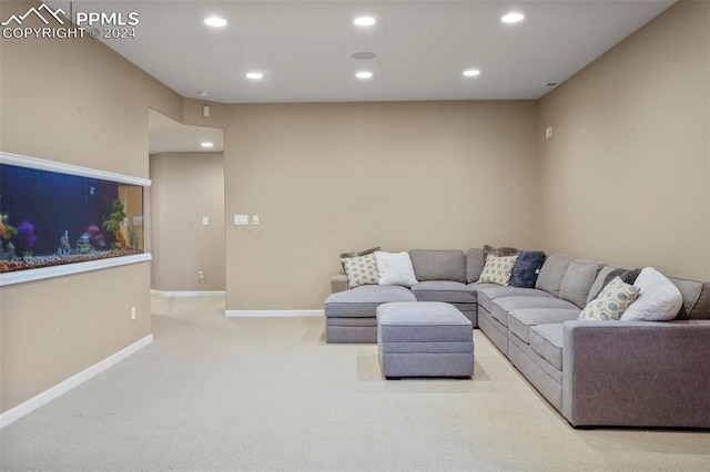 carpeted living room with recessed lighting and baseboards