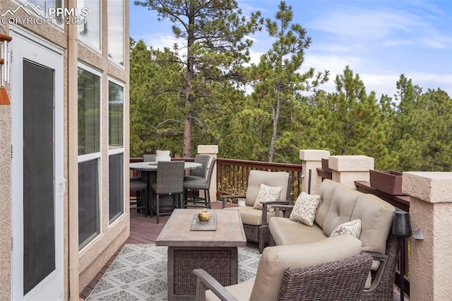 deck with outdoor dining area and an outdoor living space