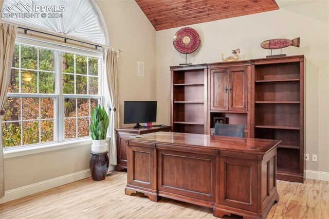 office with baseboards, vaulted ceiling, wooden ceiling, and light wood finished floors