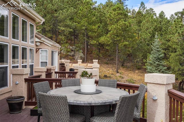 wooden deck with outdoor dining area