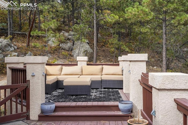 exterior space featuring a deck and outdoor lounge area