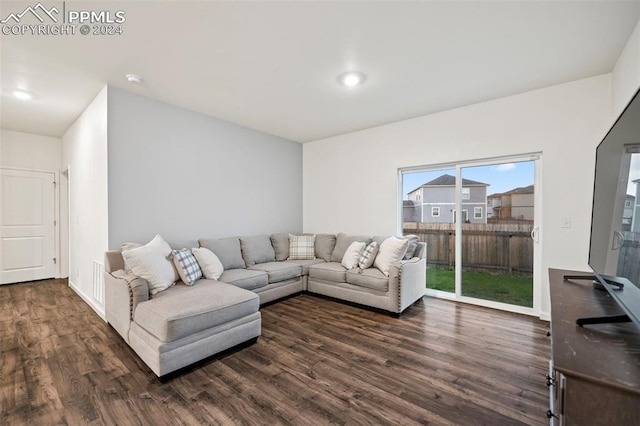 living room with dark hardwood / wood-style floors