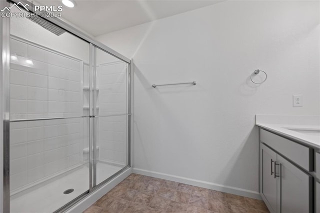 bathroom featuring vanity and walk in shower