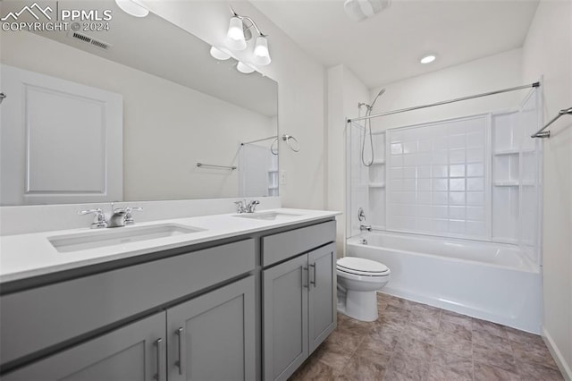 full bathroom with vanity, washtub / shower combination, and toilet