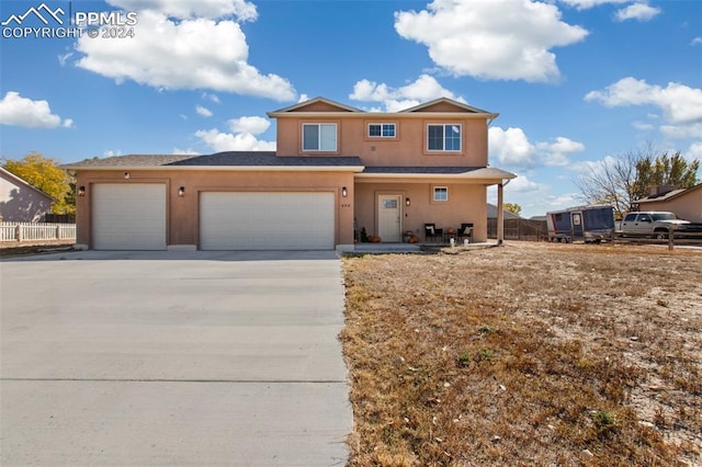 view of front of property featuring a garage