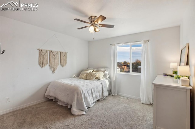 bedroom with light colored carpet and ceiling fan