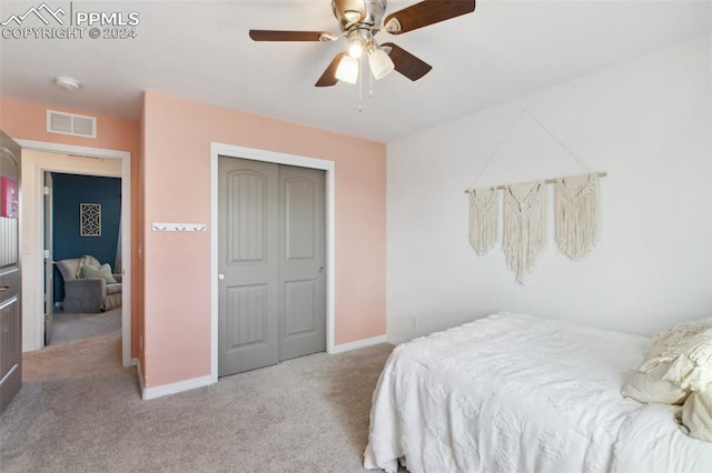 carpeted bedroom with a closet and ceiling fan