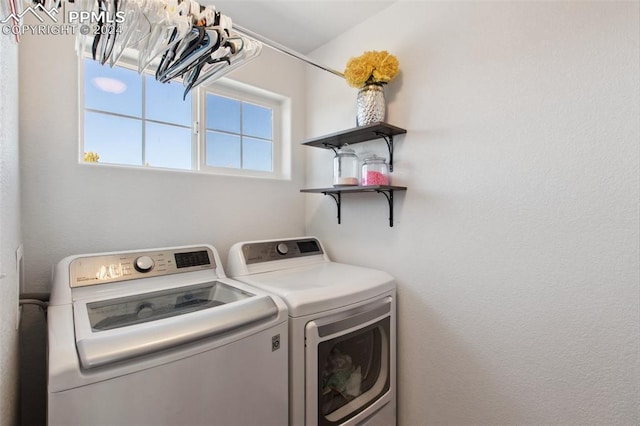 washroom with washing machine and dryer