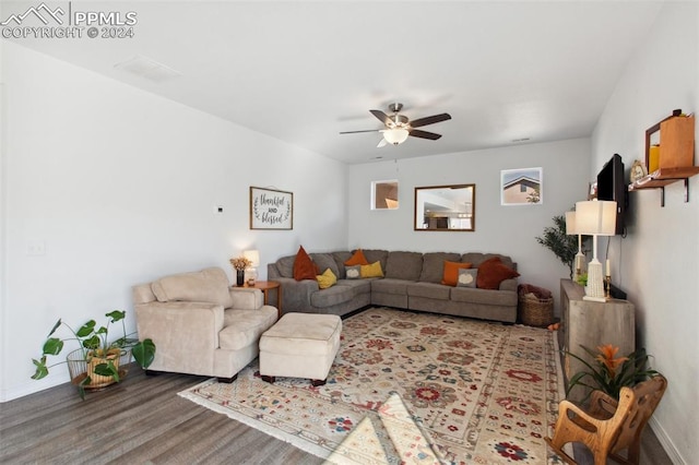 living room with hardwood / wood-style flooring and ceiling fan