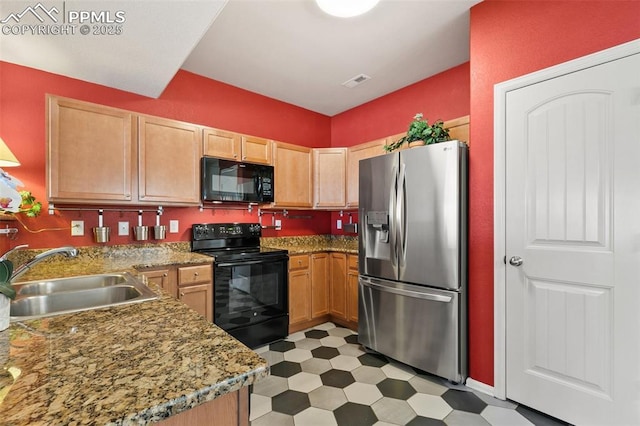 2616 Gilpin Ave, Colorado Springs, CO 80910 - kitchen with black appliances, a sink, light flooring, light brown cabinetry, and light stone counters