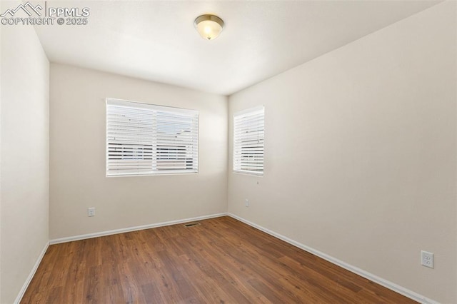 2616 Gilpin Ave, Colorado Springs, CO 80910 - spare room featuring baseboards and wood finished floors