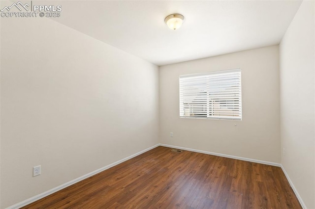 2616 Gilpin Ave, Colorado Springs, CO 80910 - spare room featuring baseboards and wood finished floors