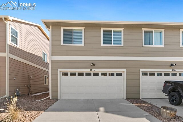 2616 Gilpin Ave, Colorado Springs, CO 80910 - view of front of property featuring a garage and concrete driveway