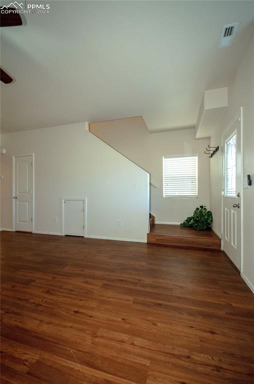 bonus room with dark wood-type flooring