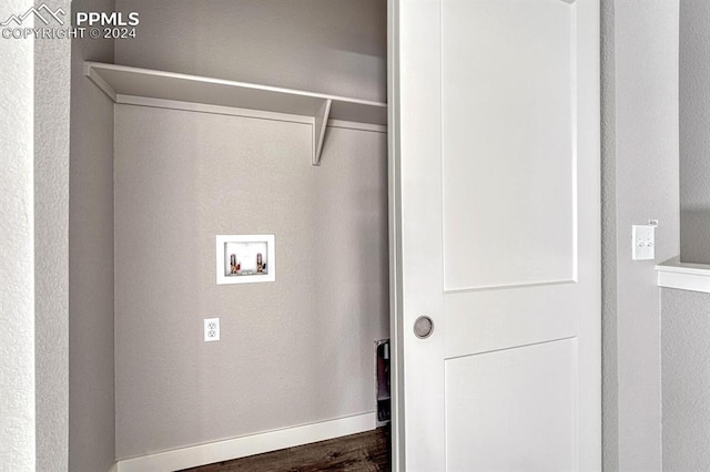 washroom featuring washer hookup and dark hardwood / wood-style flooring