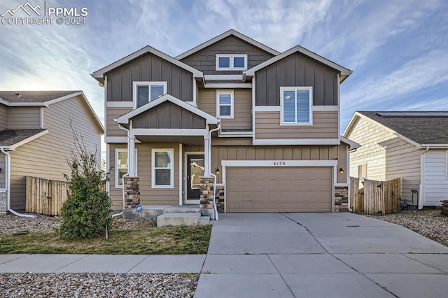 craftsman inspired home with a garage