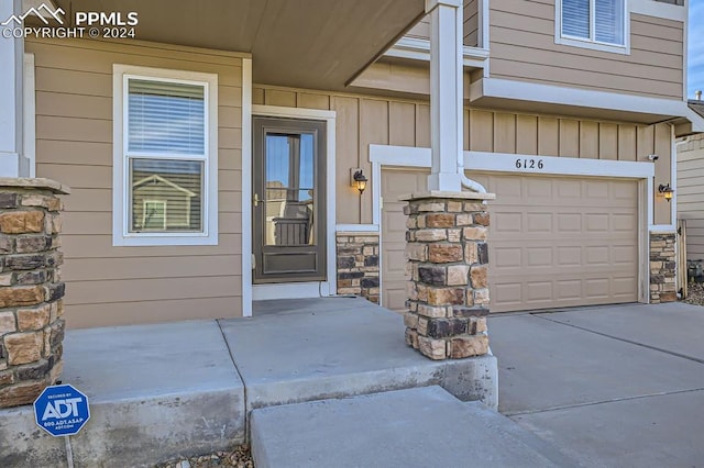 property entrance with a garage